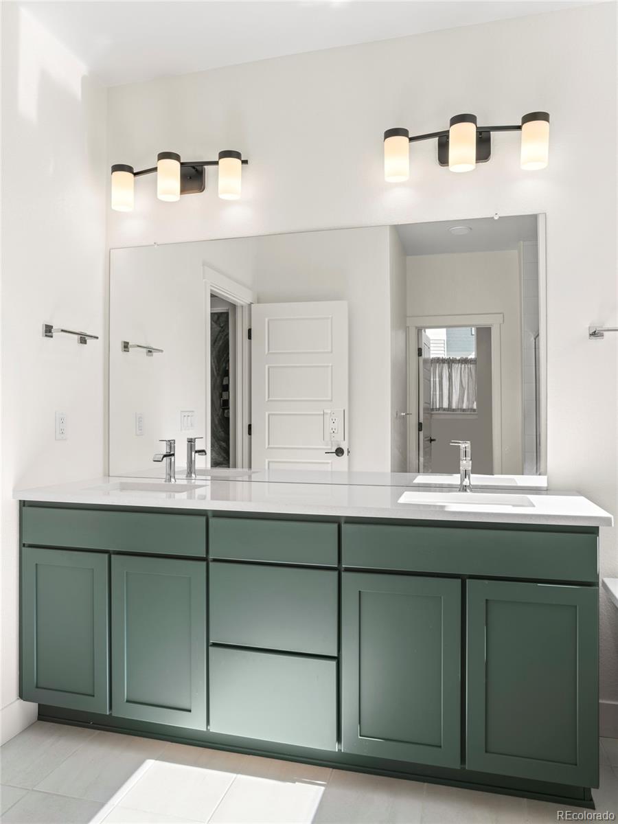 4899 Daven Road Morrison, CO 80465 - Photo 17 of 27 a bathroom with a sink and mirror