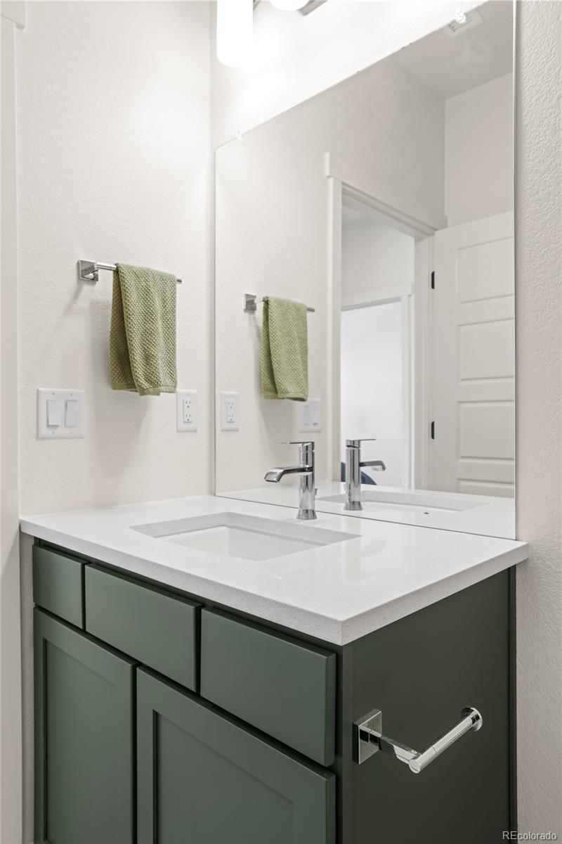 4899 Daven Road Morrison, CO 80465 - Photo 20 of 27 a bathroom with a sink and a mirror