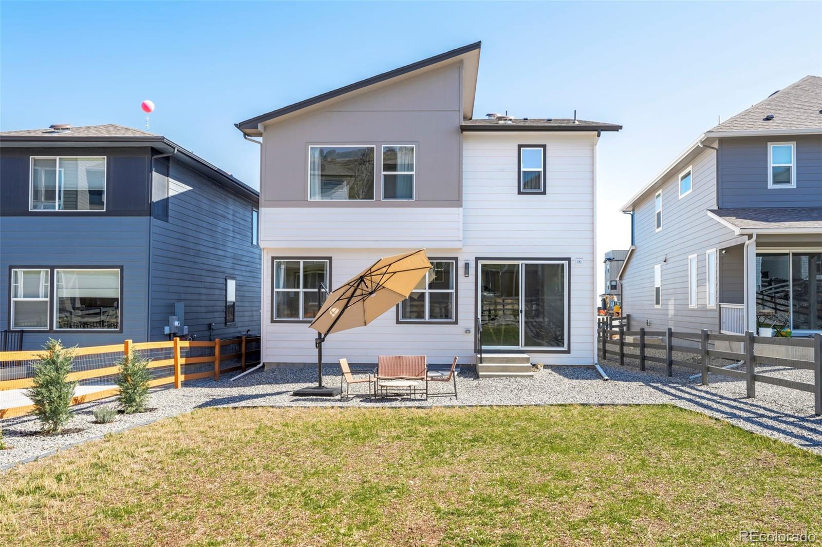 4899 Daven Road Morrison, CO 80465 - Photo 2 of 27 a view of a house with a swimming pool and sitting area