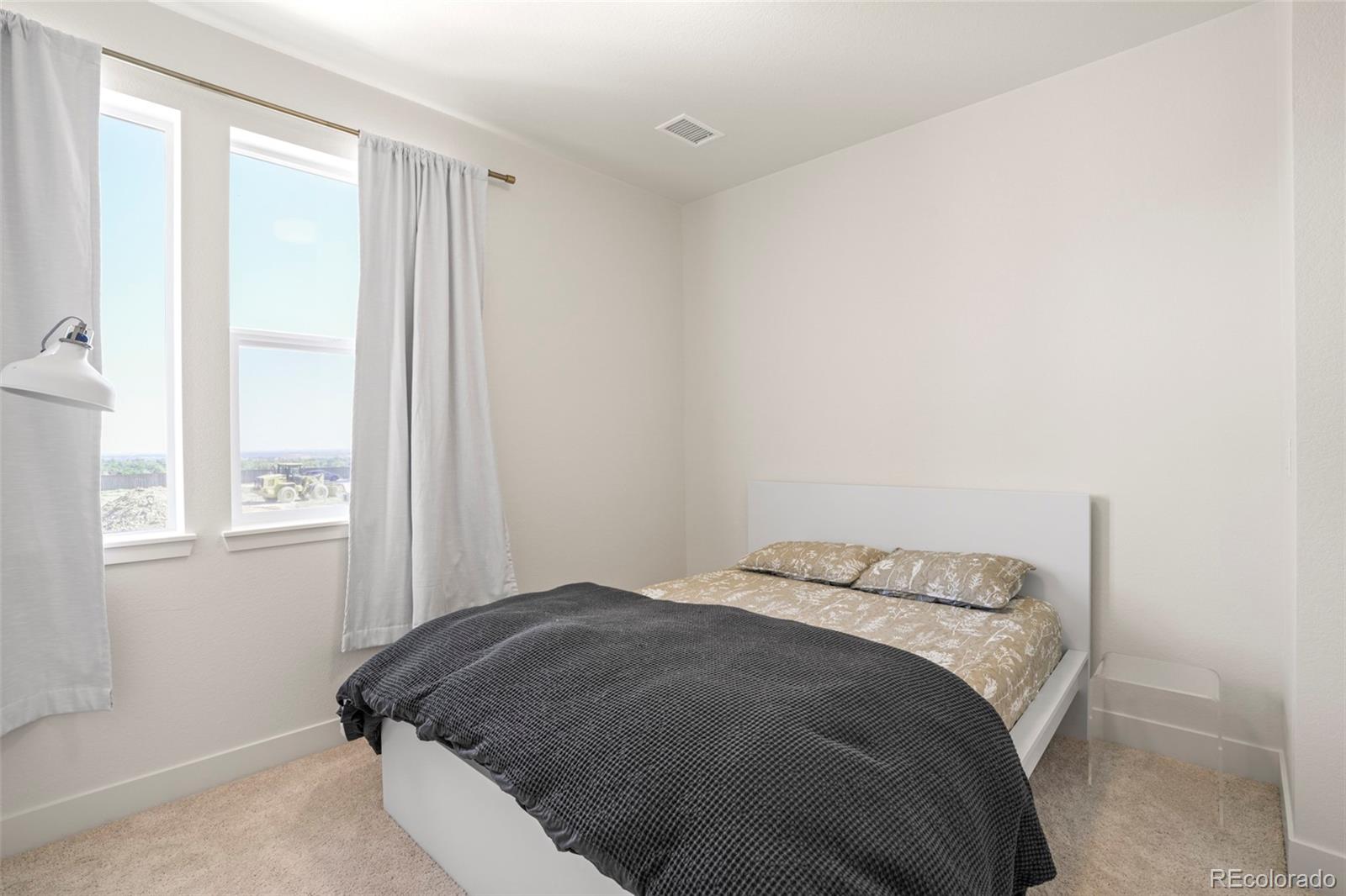 4899 Daven Road Morrison, CO 80465 - Photo 22 of 27 a bedroom with a bed and a window