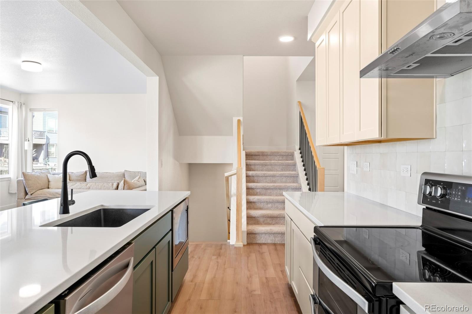 4899 Daven Road Morrison, CO 80465 - Photo 4 of 27 a kitchen with a sink and a stove top oven