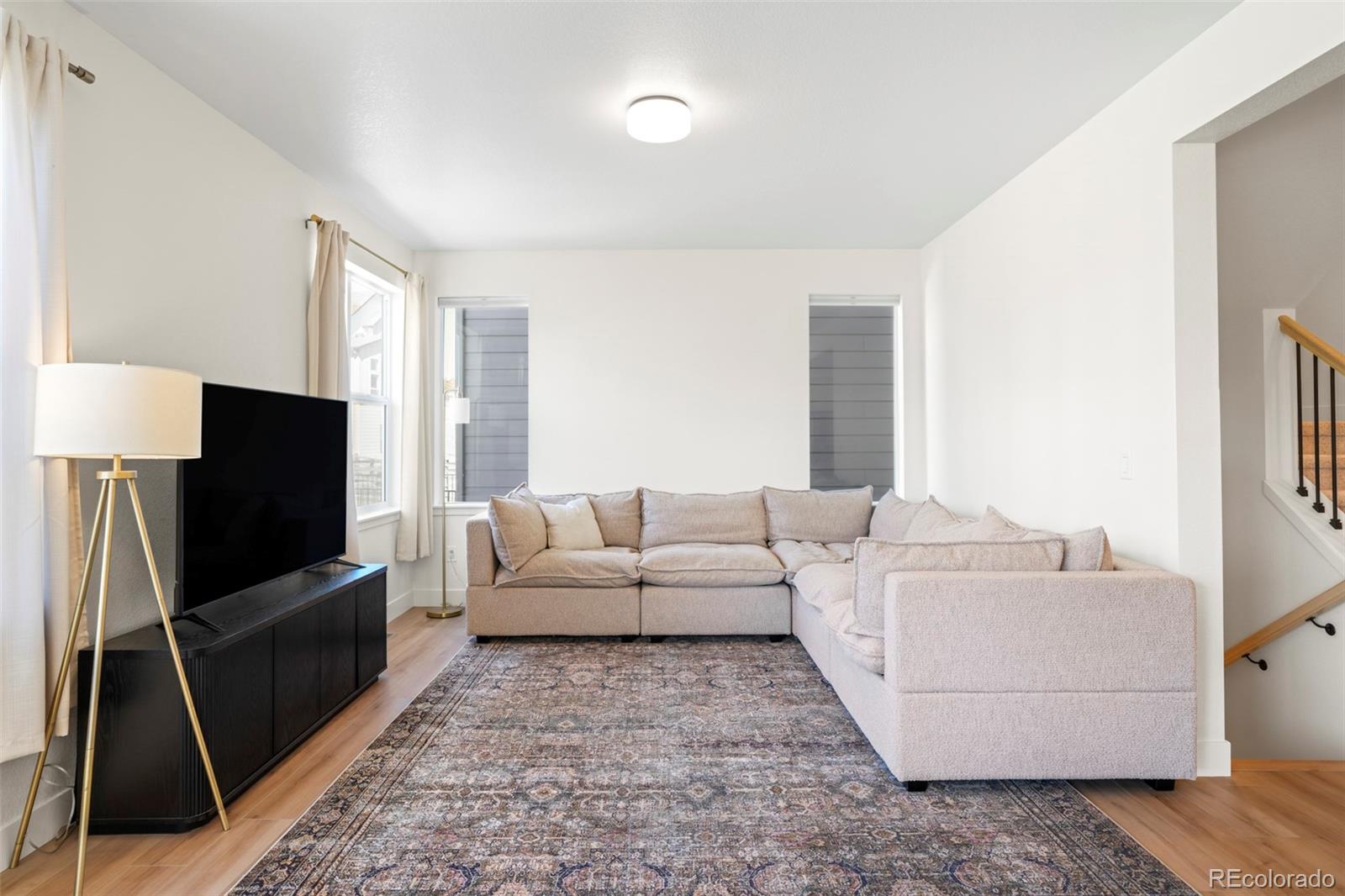 4899 Daven Road Morrison, CO 80465 - Photo 5 of 27 a living room with furniture and a flat screen tv