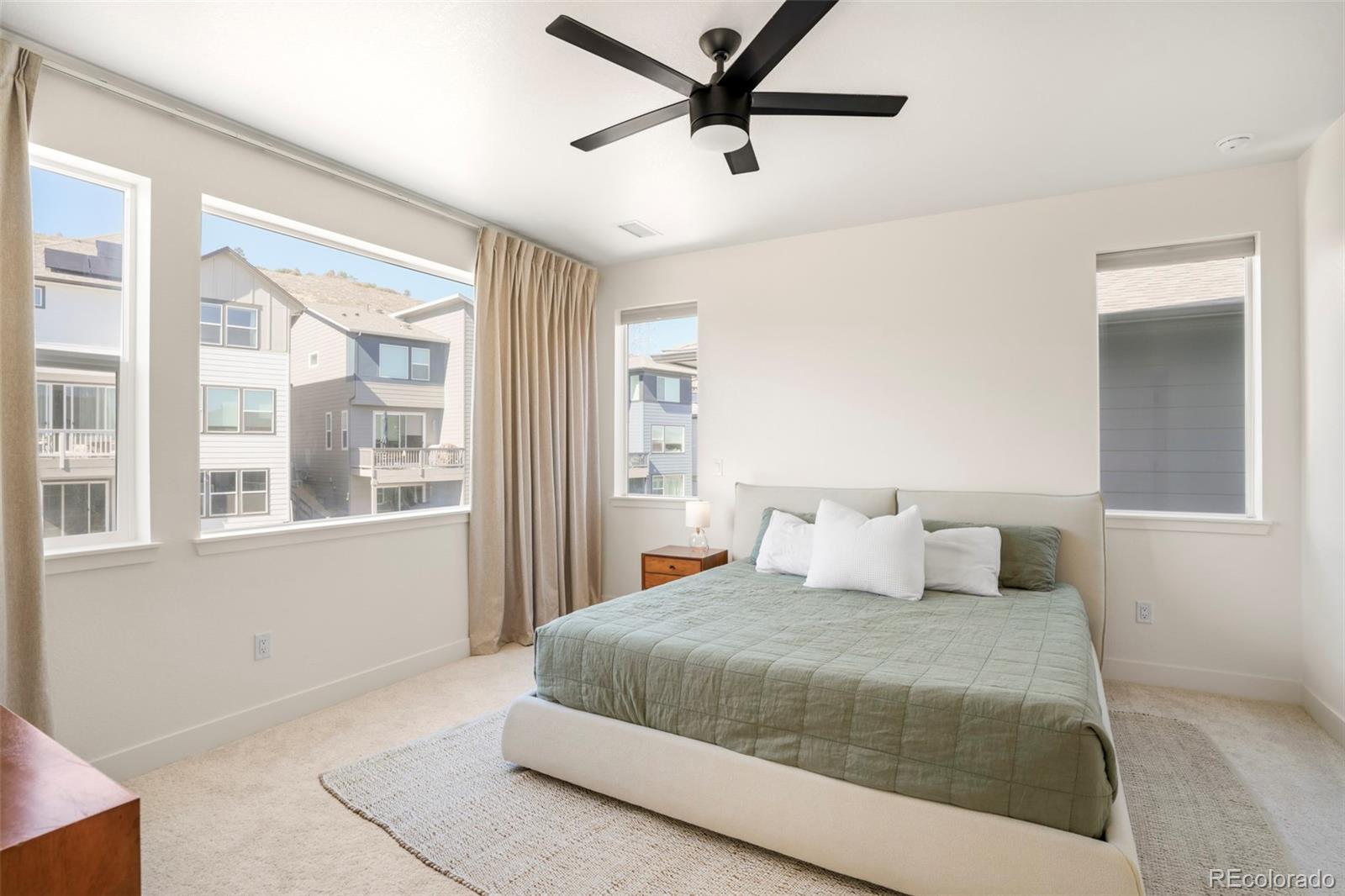 4899 Daven Road Morrison, CO 80465 - Photo 6 of 27 a bedroom with a large bed and a window