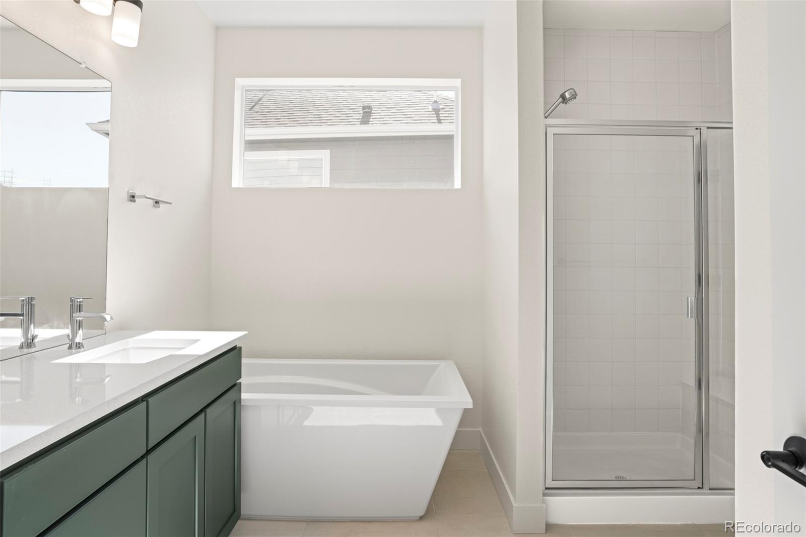 4899 Daven Road Morrison, CO 80465 - Photo 7 of 27 a bathroom with a sink a toilet and shower