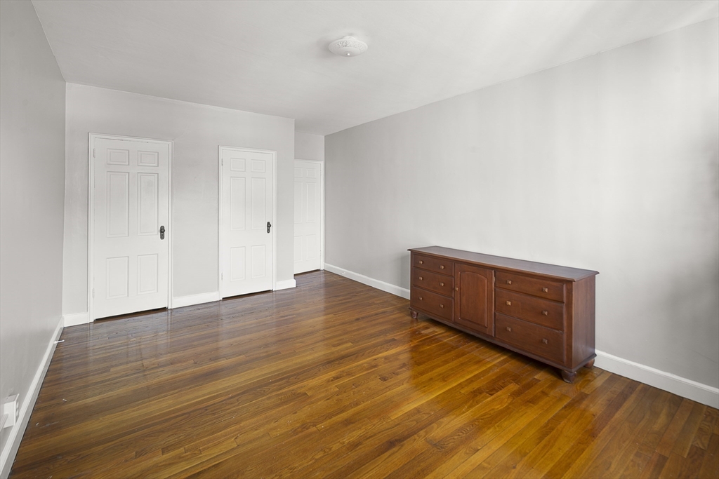 42 Browne Street, Unit 3 Brookline, MA 02446 - Photo 12 of 15 a view of an empty room with wooden floor