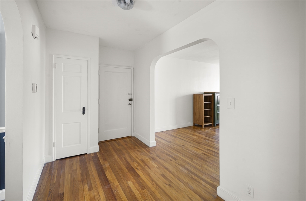 42 Browne Street, Unit 3 Brookline, MA 02446 - Photo 4 of 15 a view of a livingroom with wooden floor