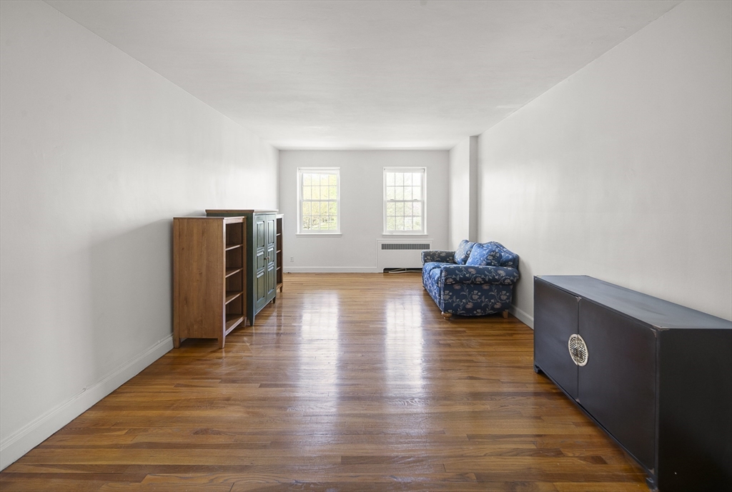 42 Browne Street, Unit 3 Brookline, MA 02446 - Photo 5 of 15 a living room with furniture and a flat screen tv