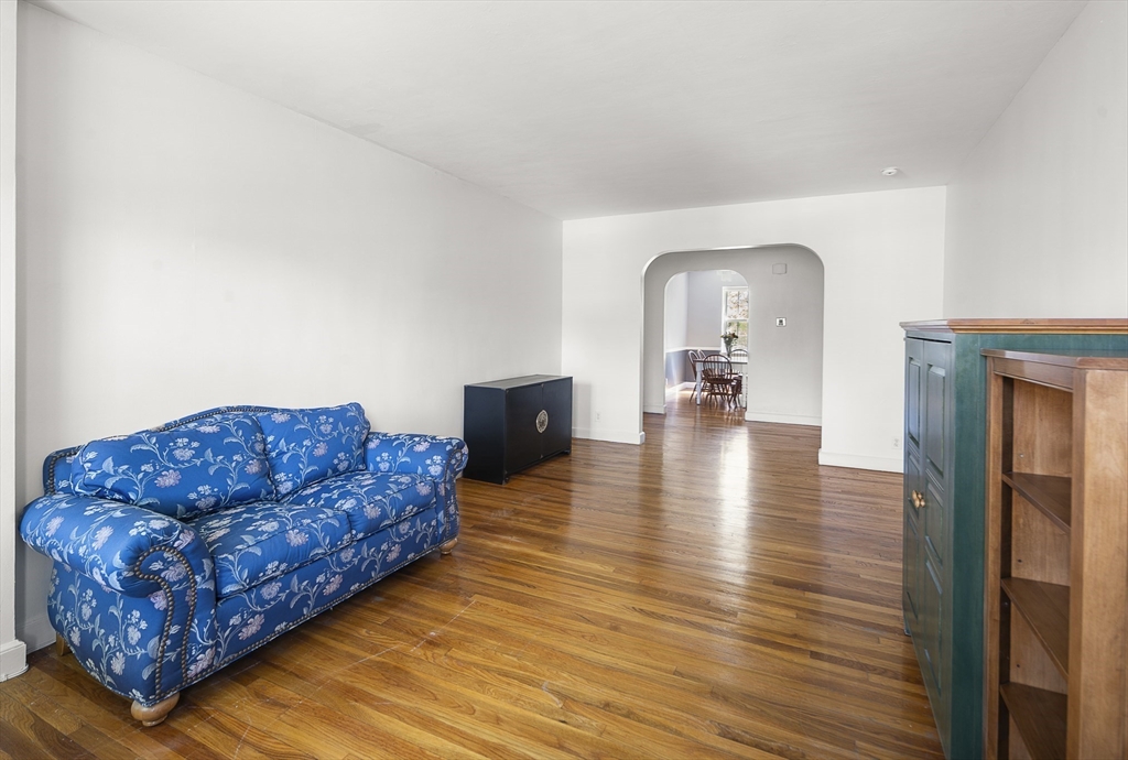 42 Browne Street, Unit 3 Brookline, MA 02446 - Photo 6 of 15 a living room with furniture rug and wooden floor