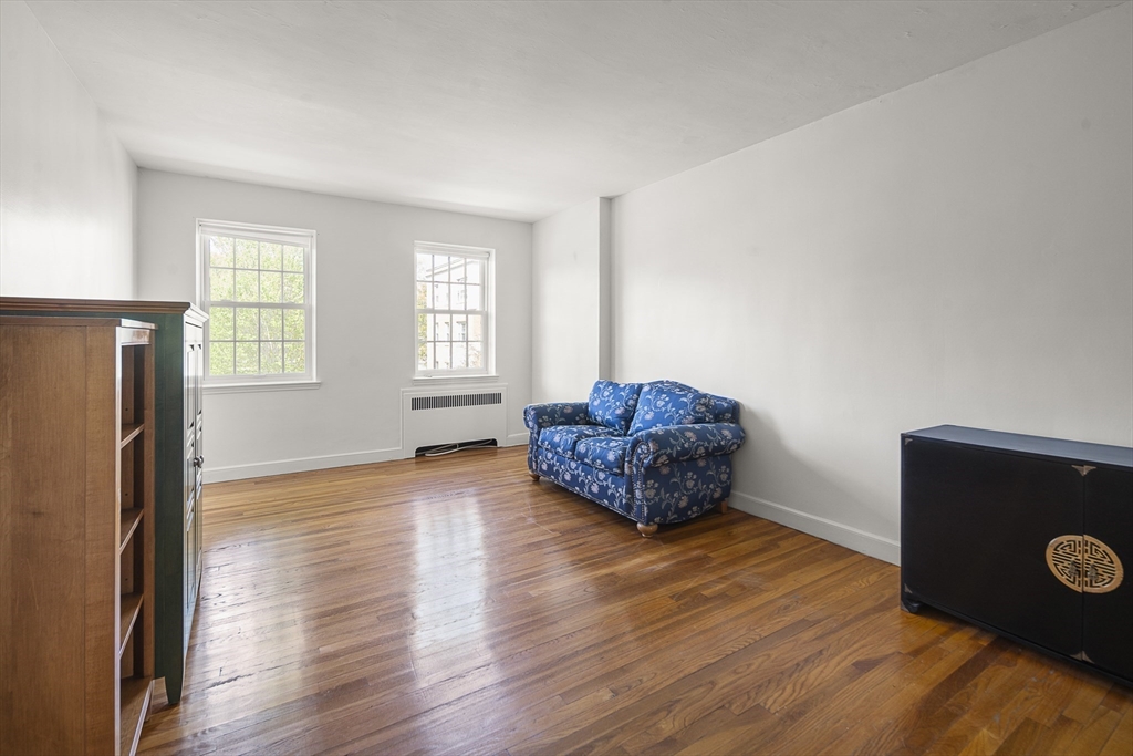 42 Browne Street, Unit 3 Brookline, MA 02446 - Photo 7 of 15 a living room with furniture and a window