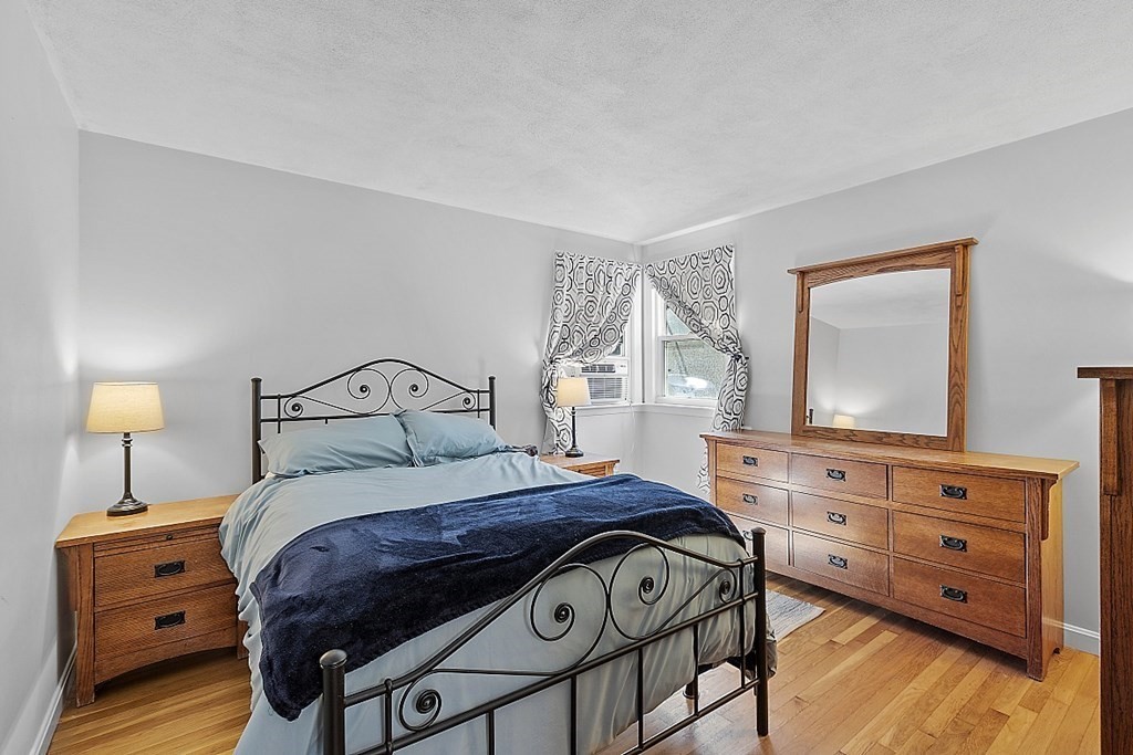 233 College Farm Road Waltham, MA 02451 - Photo 13 of 41 a bedroom with a bed and a dresser
