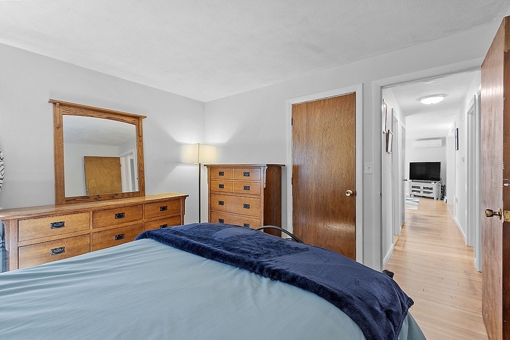 233 College Farm Road Waltham, MA 02451 - Photo 14 of 41 a bedroom with a bed and a dresser
