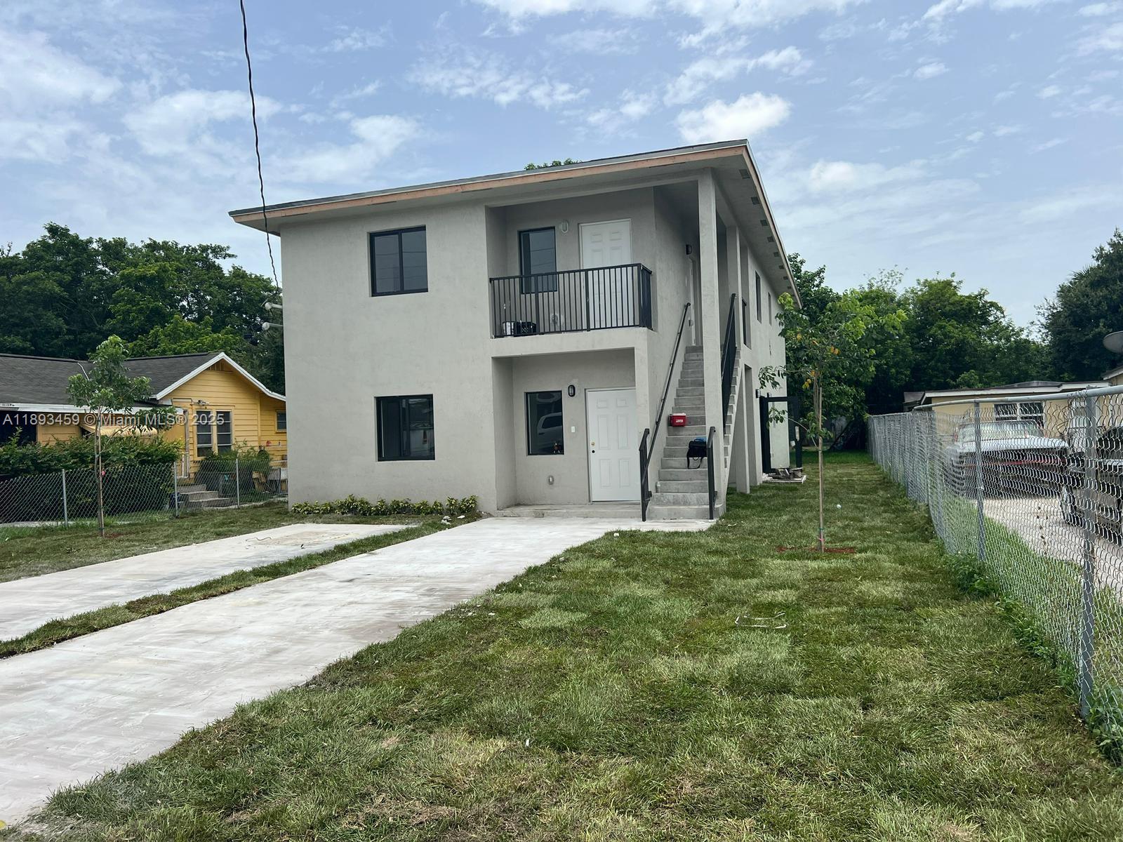 Brownsville Miami, FL 33142 - Photo 2 of 4 a front view of a house with a yard