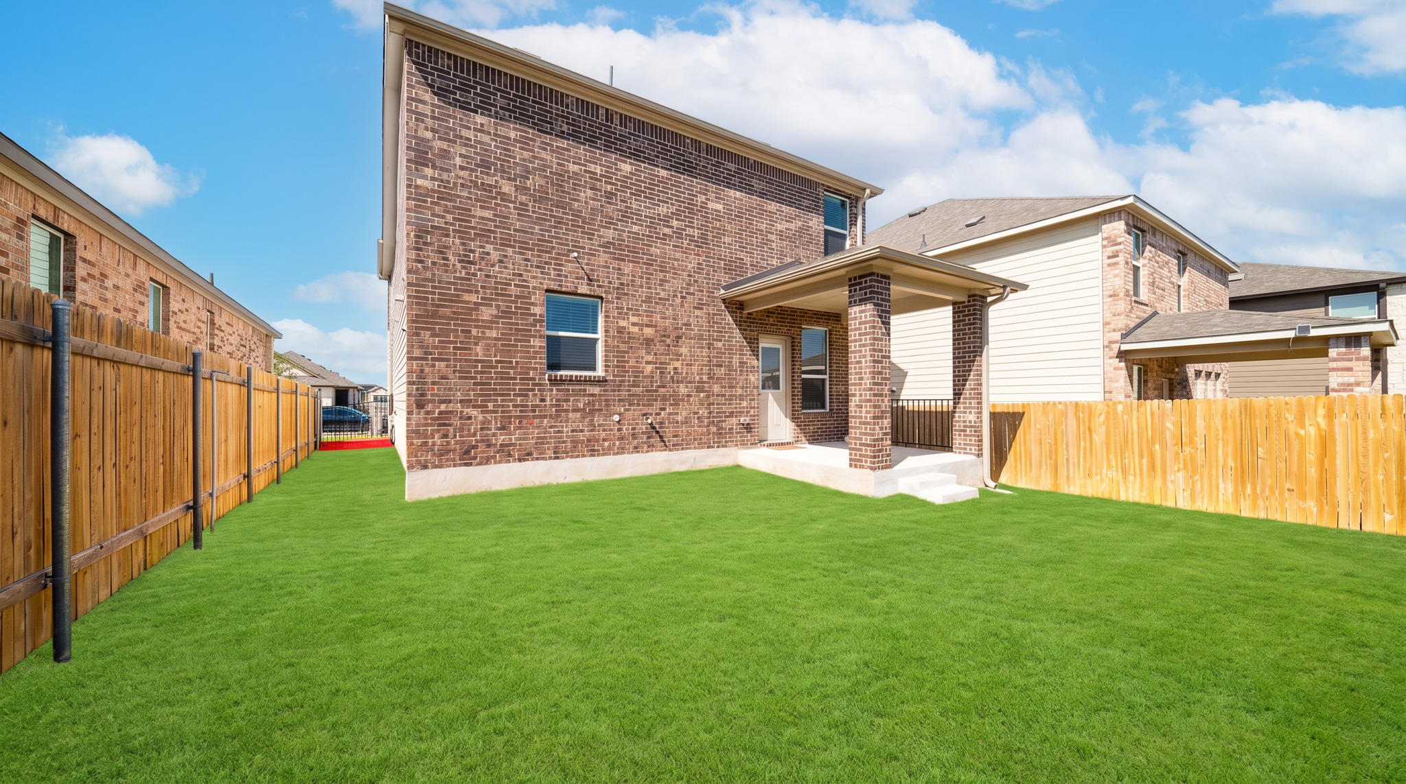 4616 Syndicate Rd Manor Manor, TX 78653 - Photo 15 of 15 A spacious backyard with a covered patio, perfect for outdoor living and entertaining.