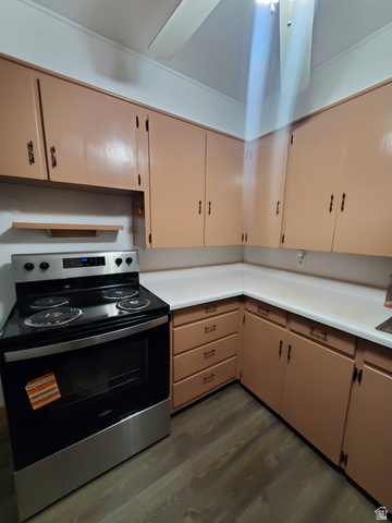 722 Adams Street Montpelier, ID 83254 - Photo 6 of 22 Kitchen featuring electric stove, light countertops, and dark wood-type flooring