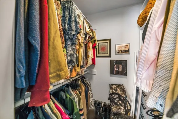 a bathroom with a double vanity sink toilet mirror and shower