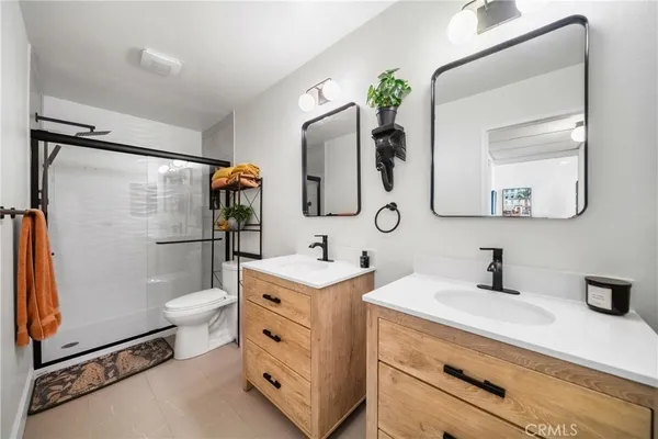 a bathroom with a sink vanity and a mirror