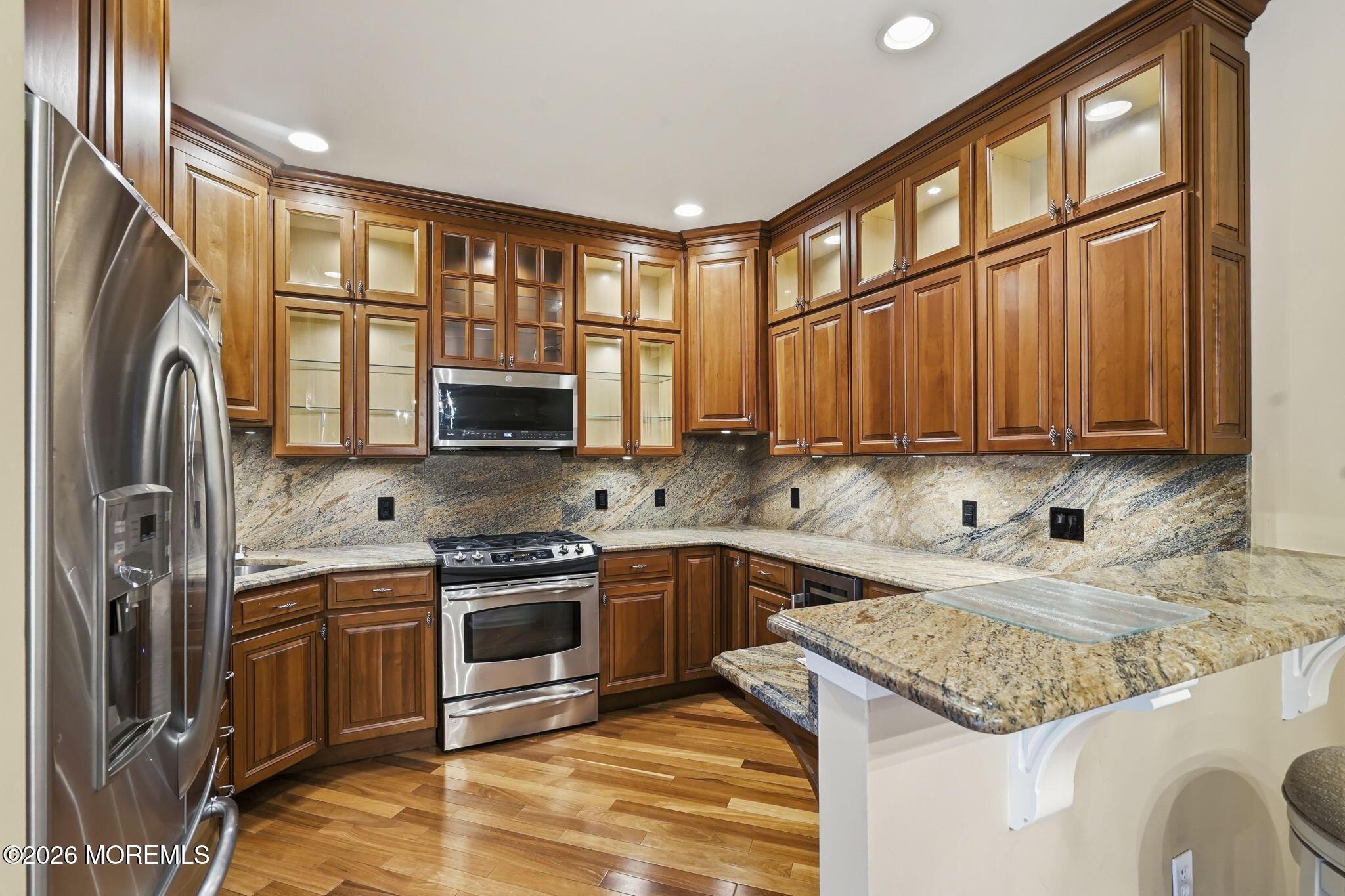 106 Potts Road Morganville, NJ 07751 - Photo 8 of 25 a kitchen with a sink stove and refrigerator