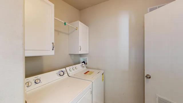 a kitchen with a stove a refrigerator and a sink
