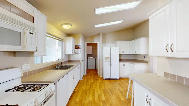 a view of a patio with table and chairs and potted plants