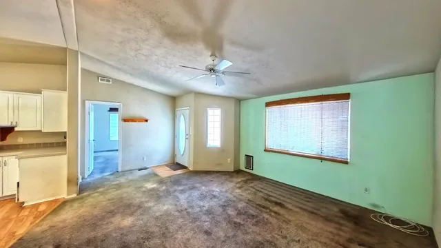 a bathroom with a shower curtain and sink