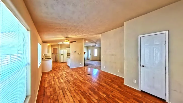 a kitchen with a stove a sink and a refrigerator