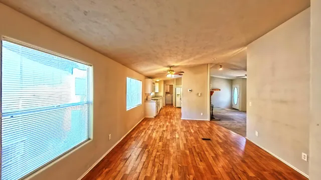 a spacious bathroom with a glass door shower and a sink