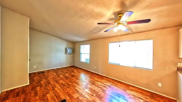 a kitchen with a refrigerator sink and cabinets