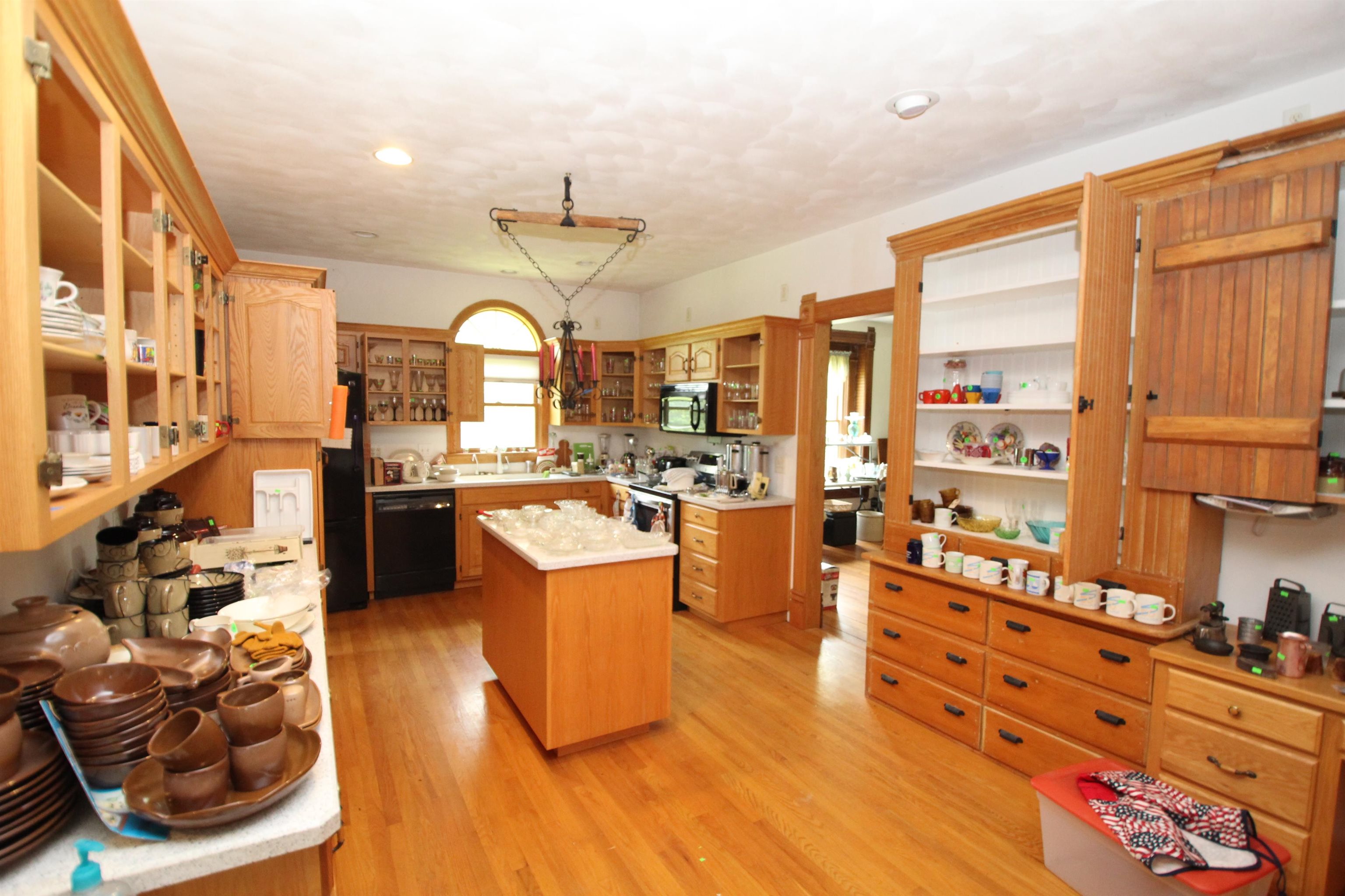 5250 Harvey Road Caledonia, IL 61011 - Photo 11 of 17 a large kitchen with stainless steel appliances kitchen island granite countertop a sink and cabinets