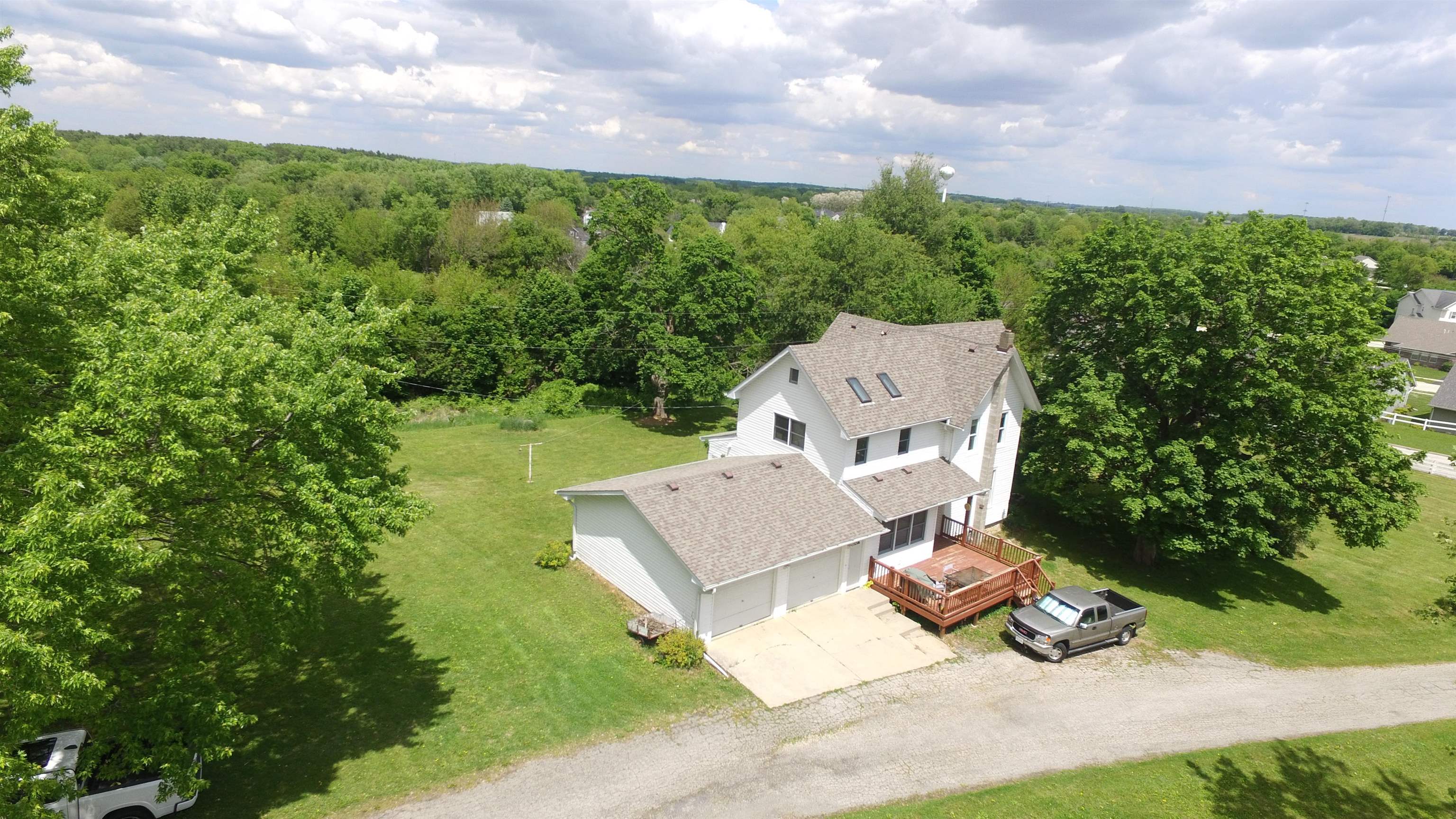 5250 Harvey Road Caledonia, IL 61011 - Photo 2 of 17 an aerial view of a house with garden space and street view