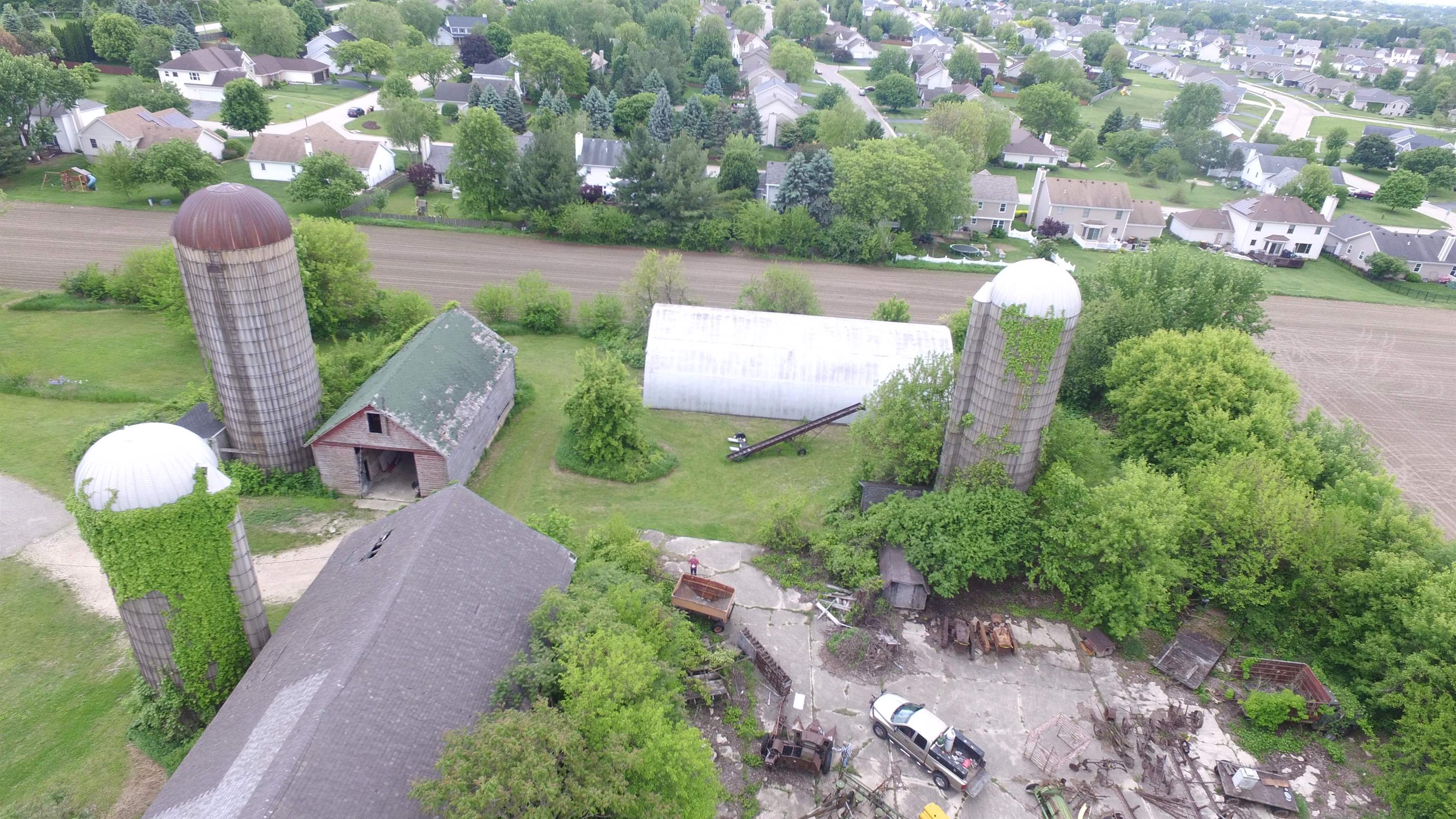5250 Harvey Road Caledonia, IL 61011 - Photo 4 of 17 a view of a garden with plants and large trees