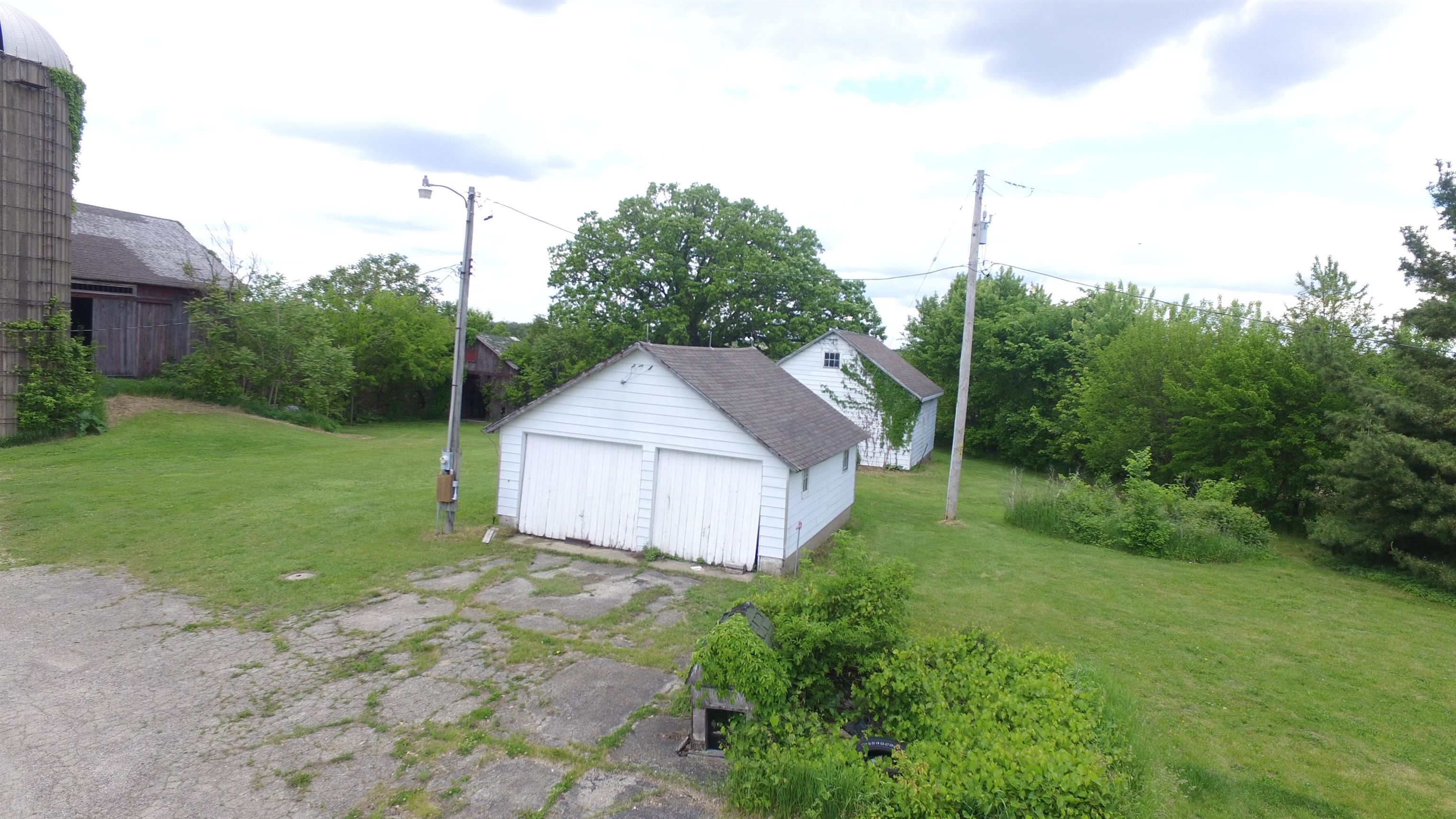 5250 Harvey Road Caledonia, IL 61011 - Photo 9 of 17 a house view with a garden
