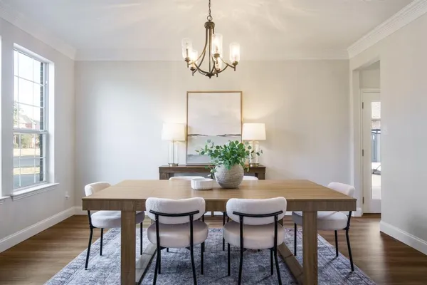 a dining room with furniture and window