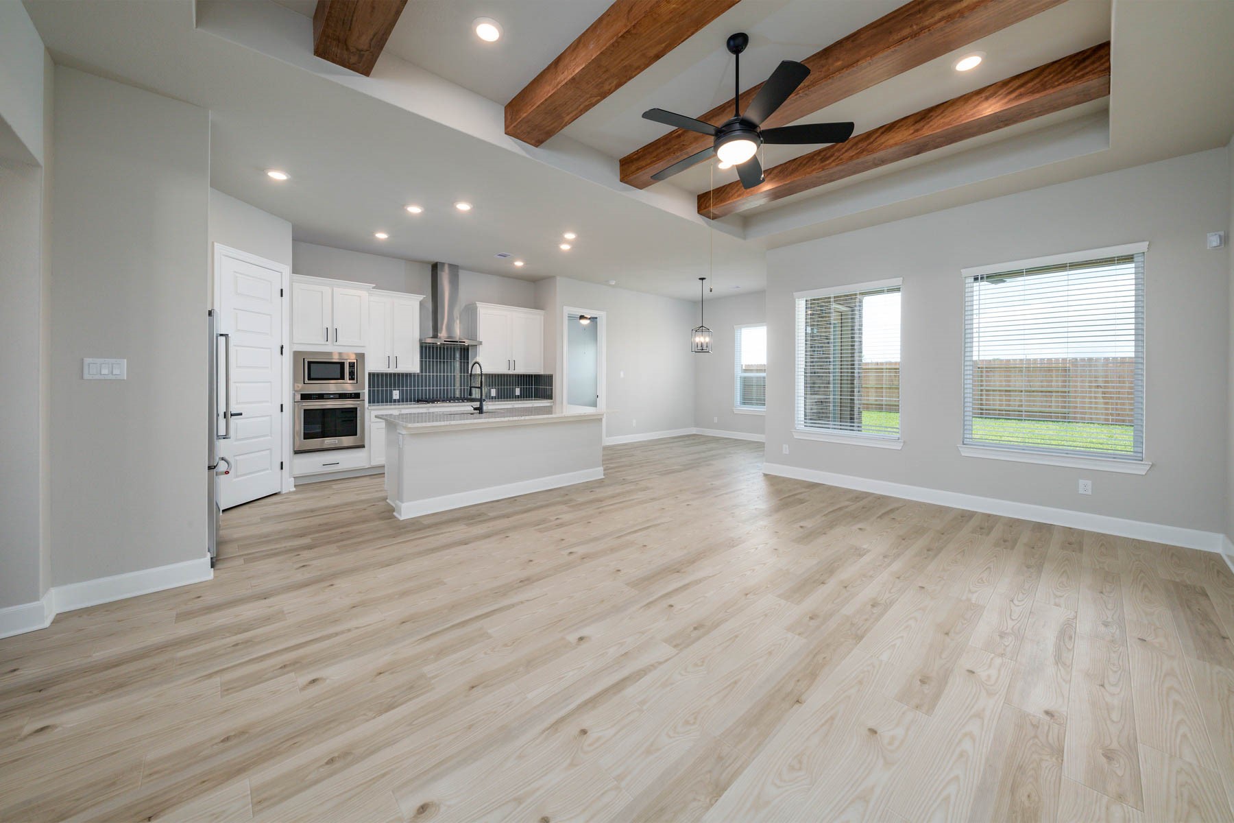 1907 June Lk Lane Iowa Colony, TX 77583 - Photo 2 of 11 a view of kitchen with cabinets and wooden floor