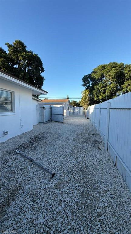 4439 23rd Place Southwest Naples, FL 34116 - Photo 14 of 15 View of fenced backyard
