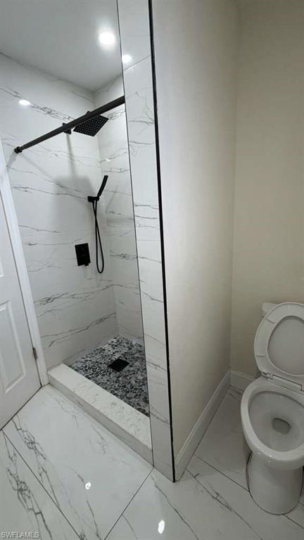 4439 23rd Place Southwest Naples, FL 34116 - Photo 6 of 15 Bathroom featuring light marble finish floors and a marble finish shower