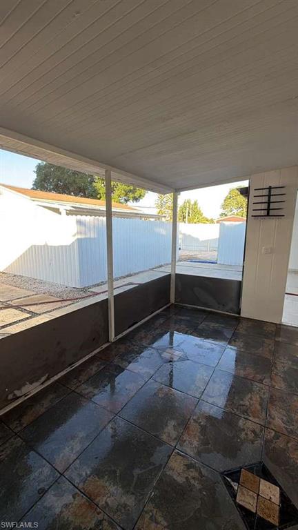 4439 23rd Place Southwest Naples, FL 34116 - Photo 8 of 15 Unfurnished sunroom featuring healthy amount of natural light