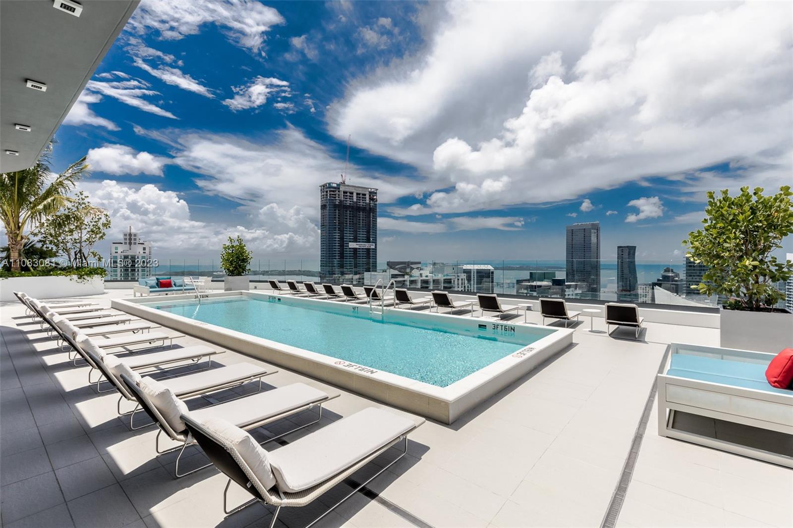 45 Southwest 9th Street, Unit 2207 Miami, FL 33130 - Photo 1 of 31 a view of a swimming pool with outdoor seating