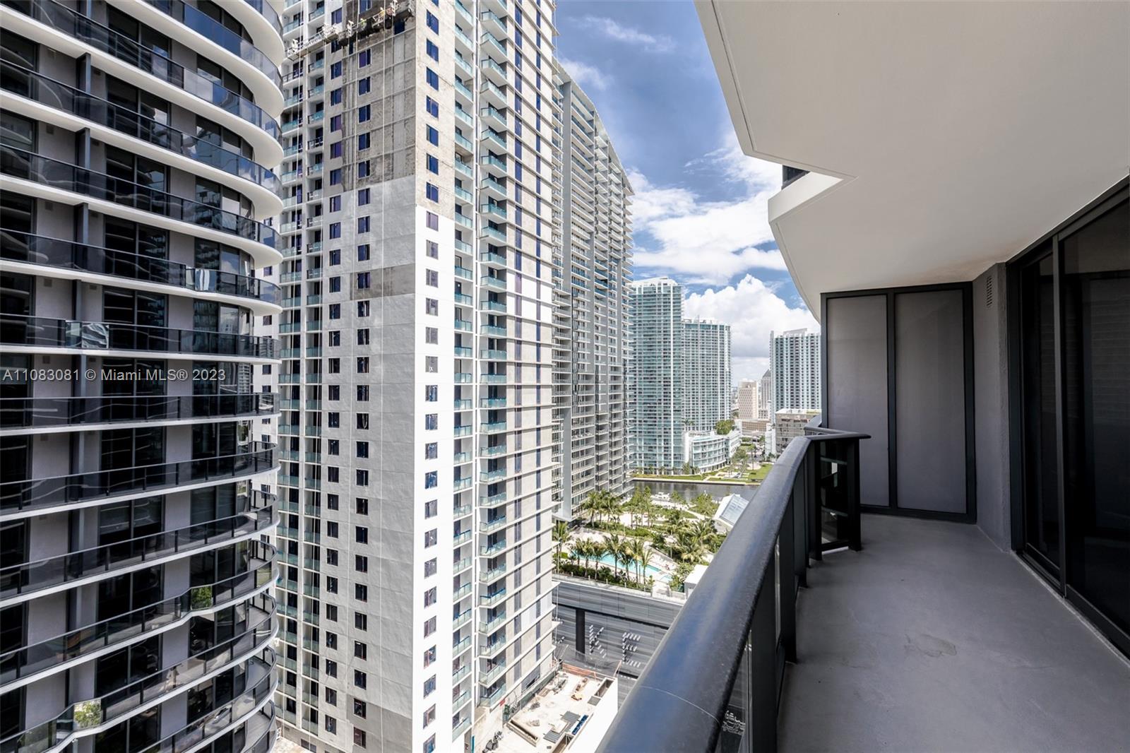 45 Southwest 9th Street, Unit 2207 Miami, FL 33130 - Photo 17 of 31 a view of a walk in closet and bedroom
