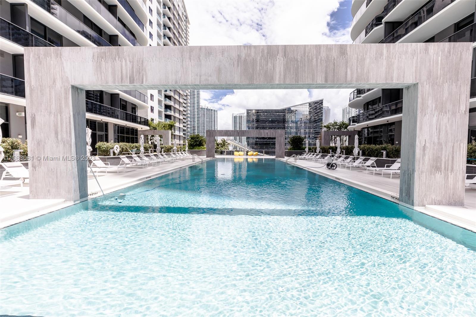 45 Southwest 9th Street, Unit 2207 Miami, FL 33130 - Photo 23 of 31 a view of a swimming pool with a patio