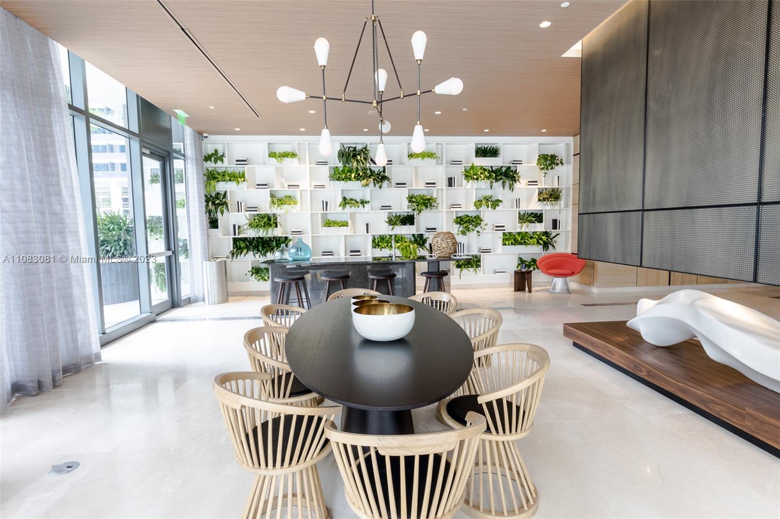 45 Southwest 9th Street, Unit 2207 Miami, FL 33130 - Photo 29 of 31 a kitchen with a table and chairs