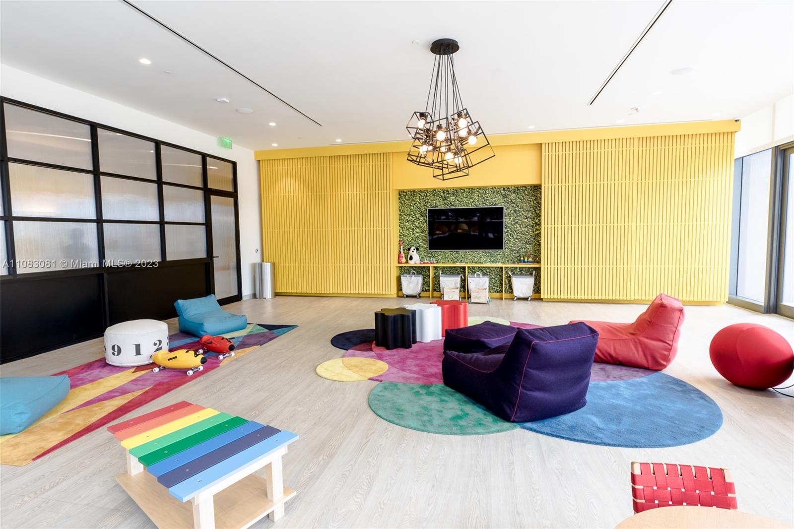 45 Southwest 9th Street, Unit 2207 Miami, FL 33130 - Photo 30 of 31 a bed room with a bed furniture and a flat screen tv