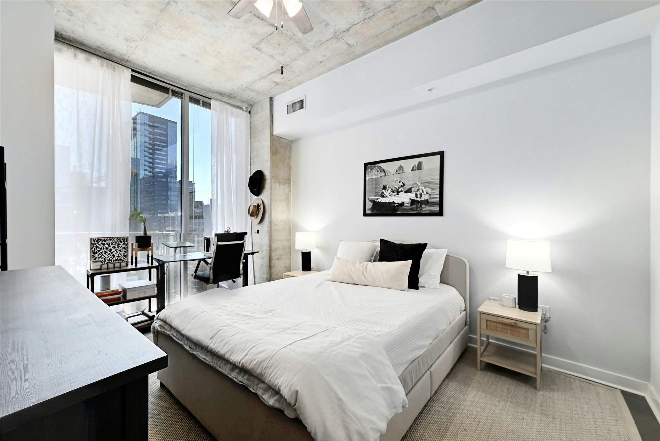 360 Nueces Street, Unit 1809 Austin, TX 78701 - Photo 18 of 25 Bedroom with ceiling fan, a city view, access to exterior, and floor to ceiling windows