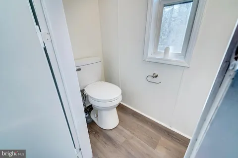 a bathroom with a toilet and a sink