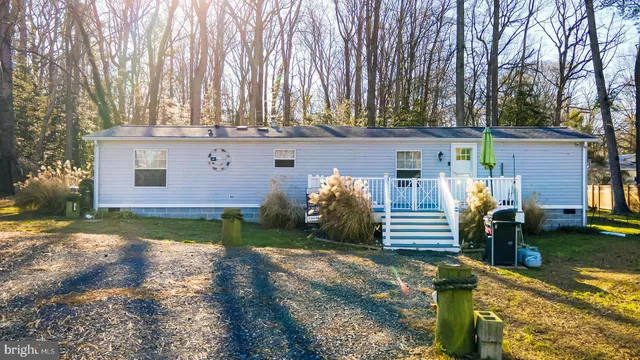 a view of a backyard with sitting area