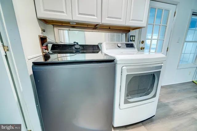 a kitchen with stainless steel appliances granite countertop a sink and a microwave