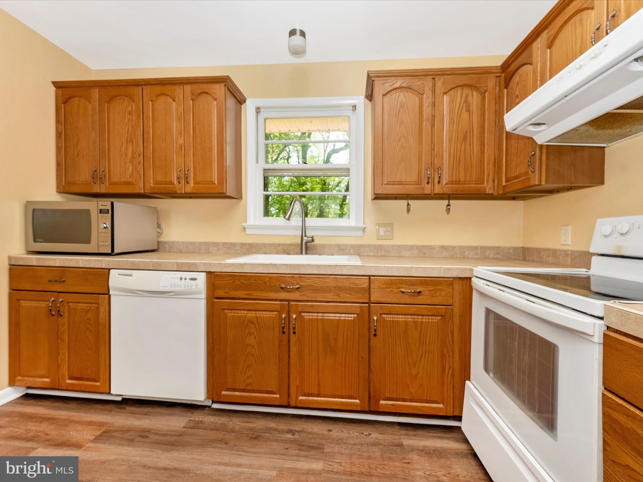 2833 Roderick Road Frederick, MD 21704 - Photo 11 of 41 a kitchen with granite countertop cabinets stainless steel appliances a sink and window
