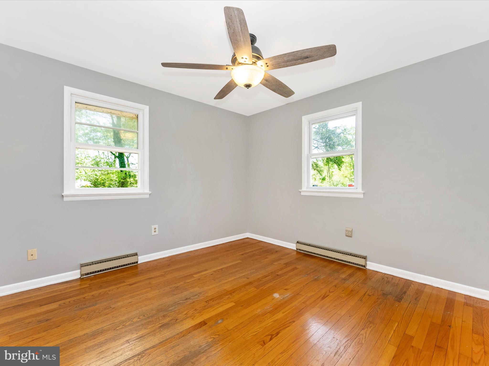 2833 Roderick Road Frederick, MD 21704 - Photo 17 of 41 a view of an empty room with window and wooden floor