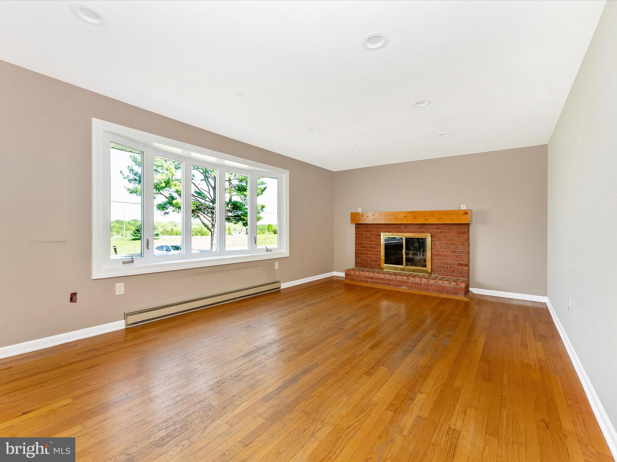 2833 Roderick Road Frederick, MD 21704 - Photo 2 of 41 an empty room with wooden floor and windows
