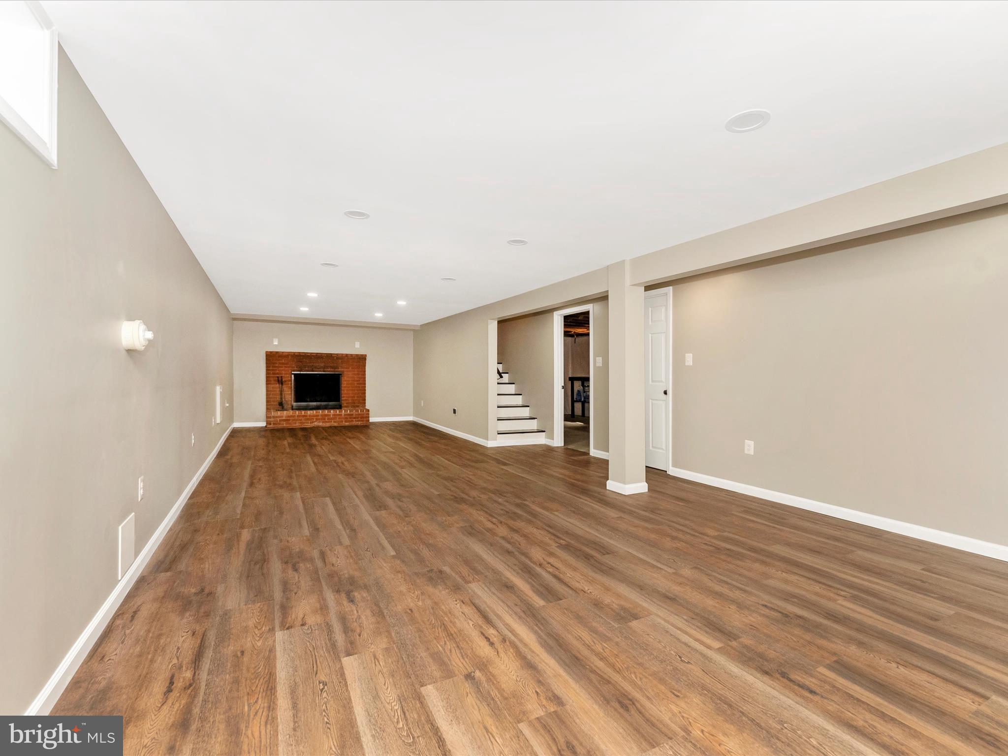 2833 Roderick Road Frederick, MD 21704 - Photo 26 of 41 a view of empty room with wooden floor and plants