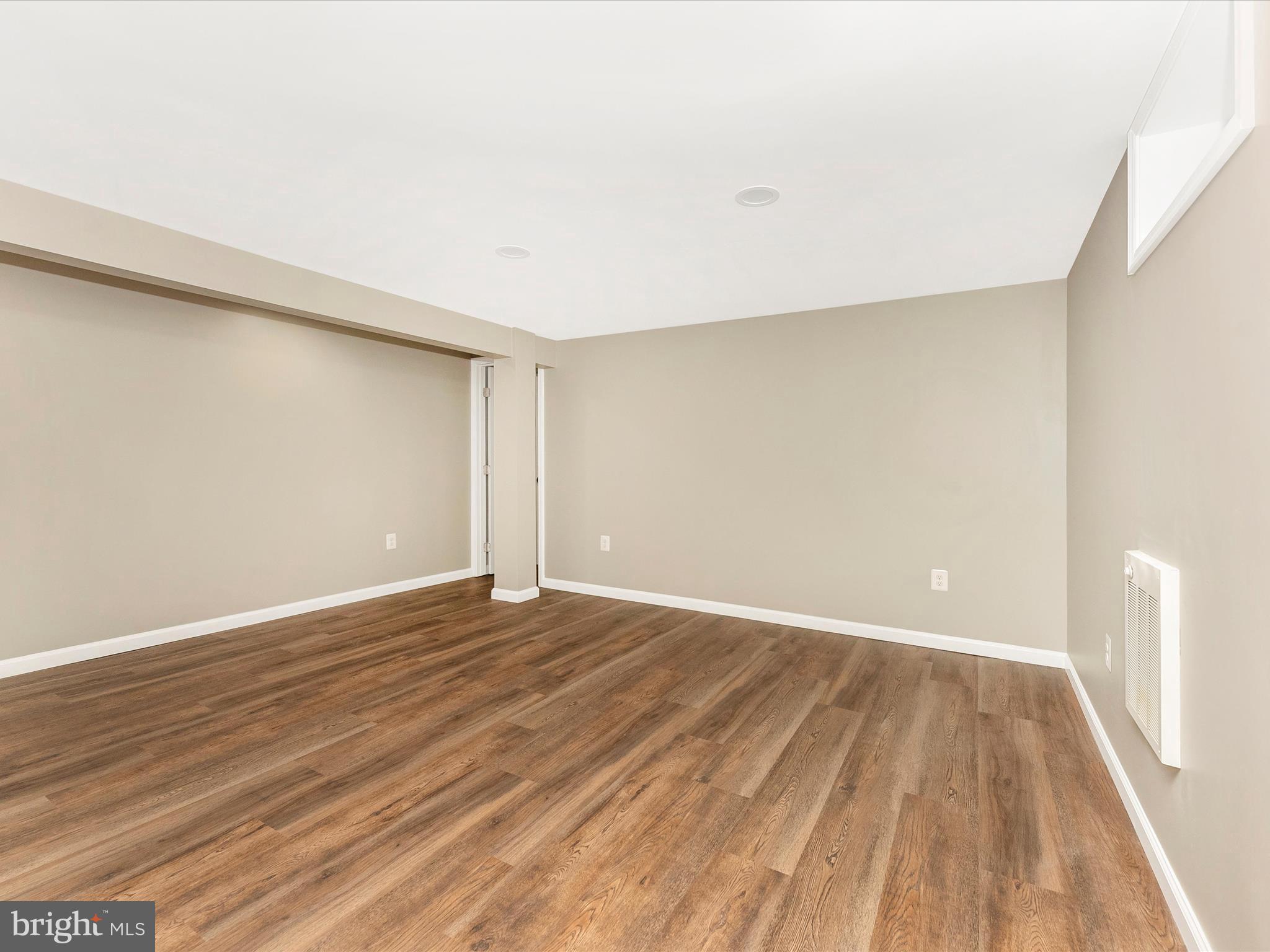2833 Roderick Road Frederick, MD 21704 - Photo 29 of 41 a view of an empty room with wooden floor